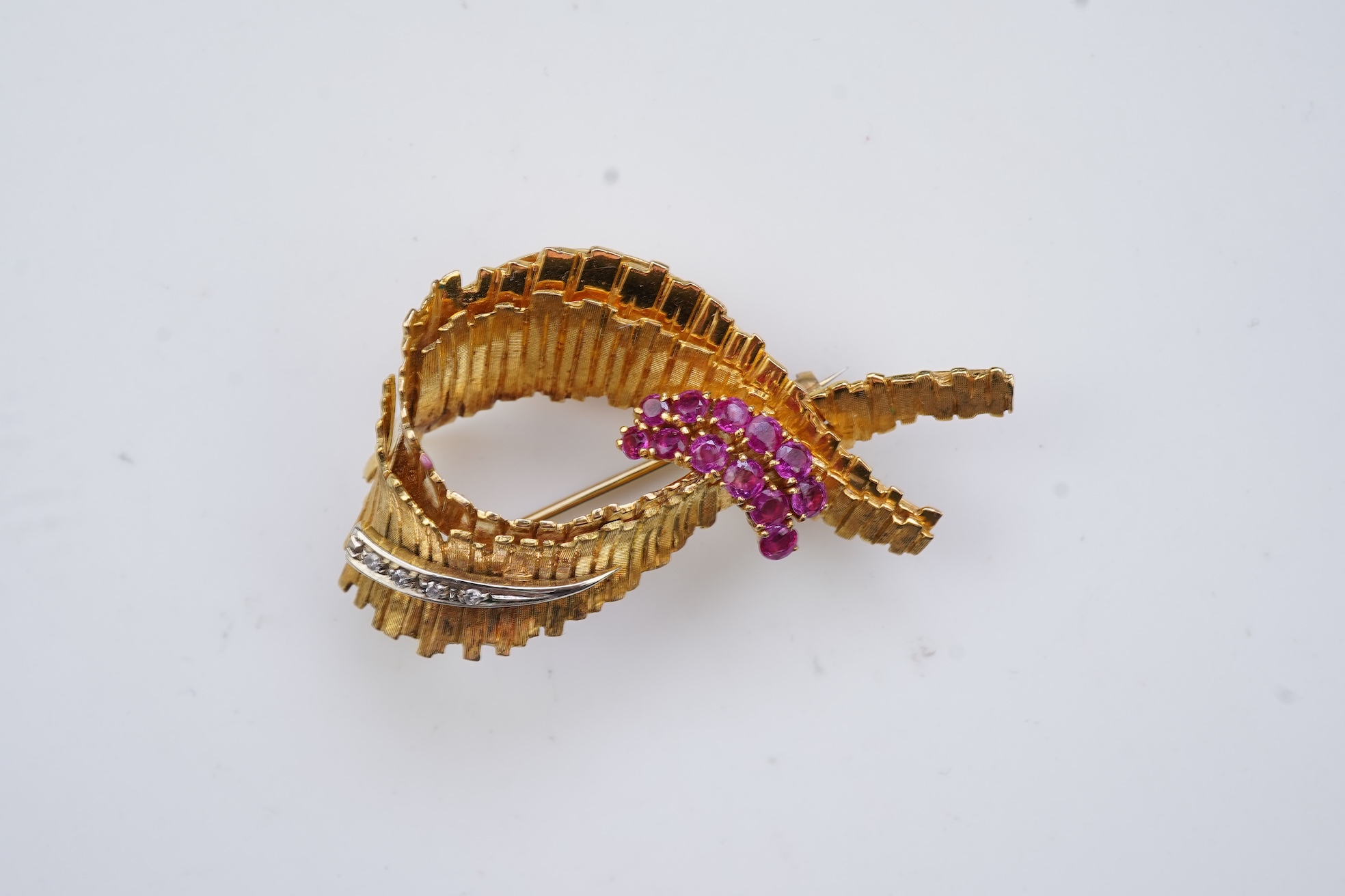 A gold, ruby and diamond brooch, circa 1965